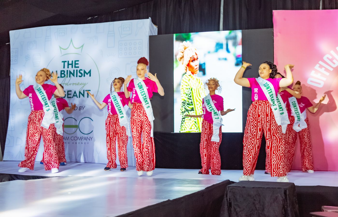 Contestants performing on stage at the Albinism Advocacy Pageant